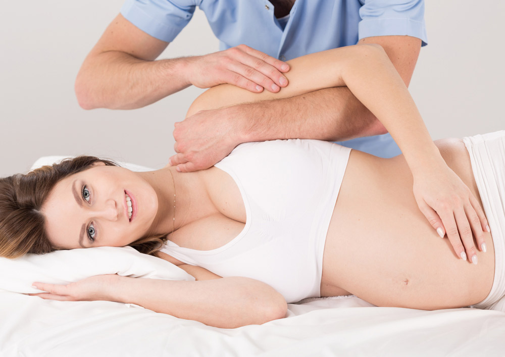 Pregnant Woman having prenatal adjustment